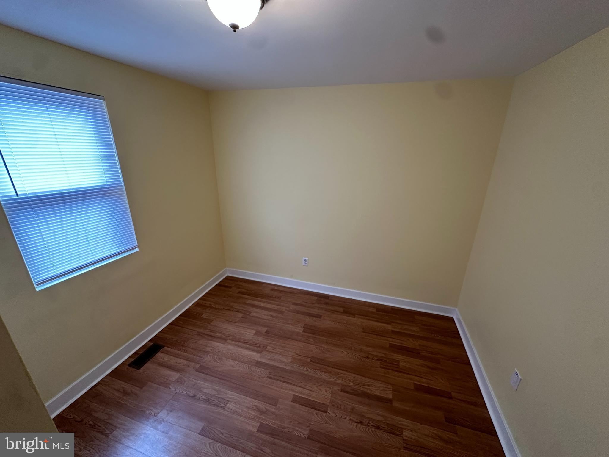 2712 Sherman Avenue Northwest Washington, DC 20001 - Photo 41 of 69 a view of a room with wooden floor and a window