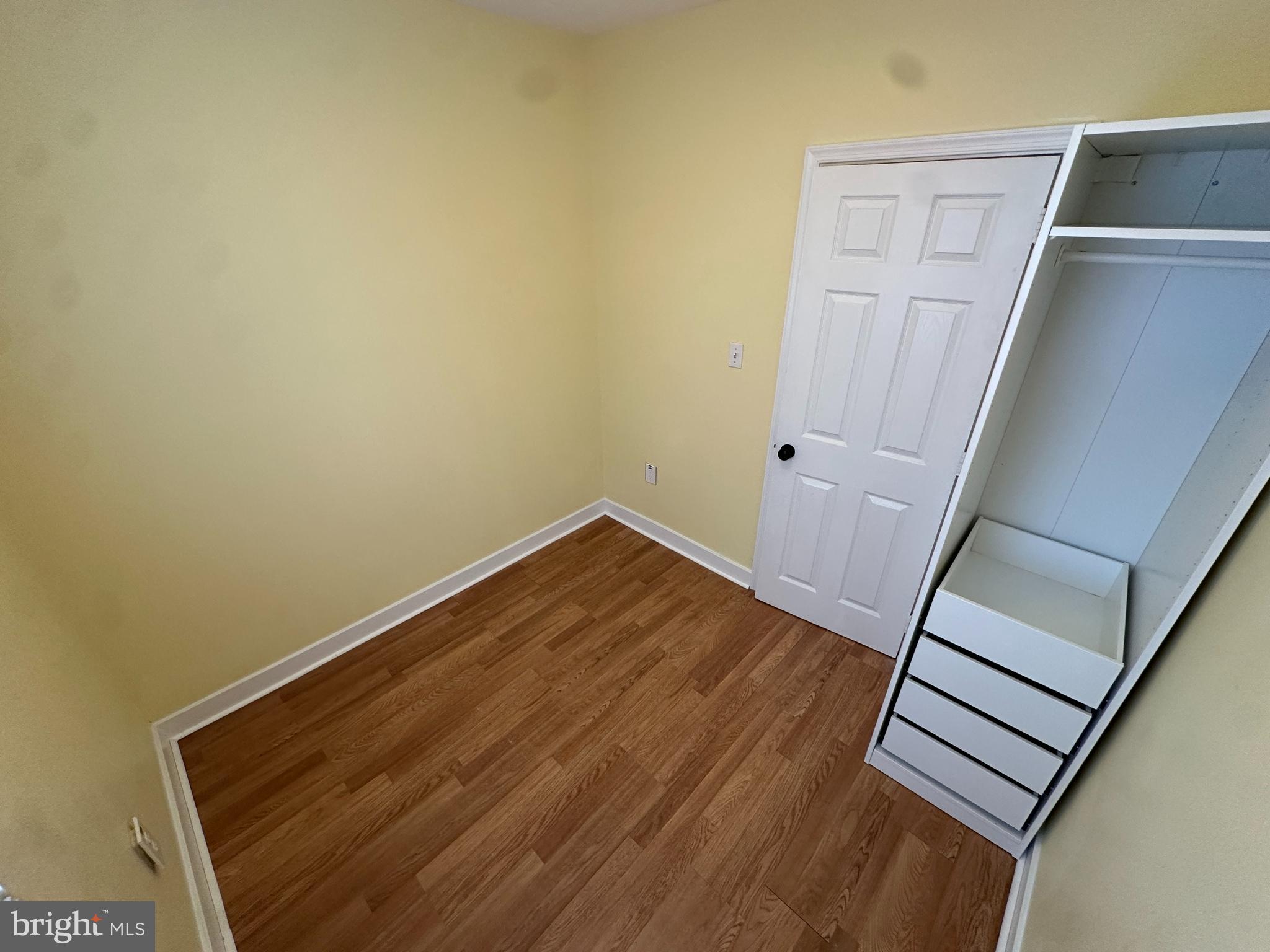2712 Sherman Avenue Northwest Washington, DC 20001 - Photo 43 of 69 a view of a room with wooden floor and staircase