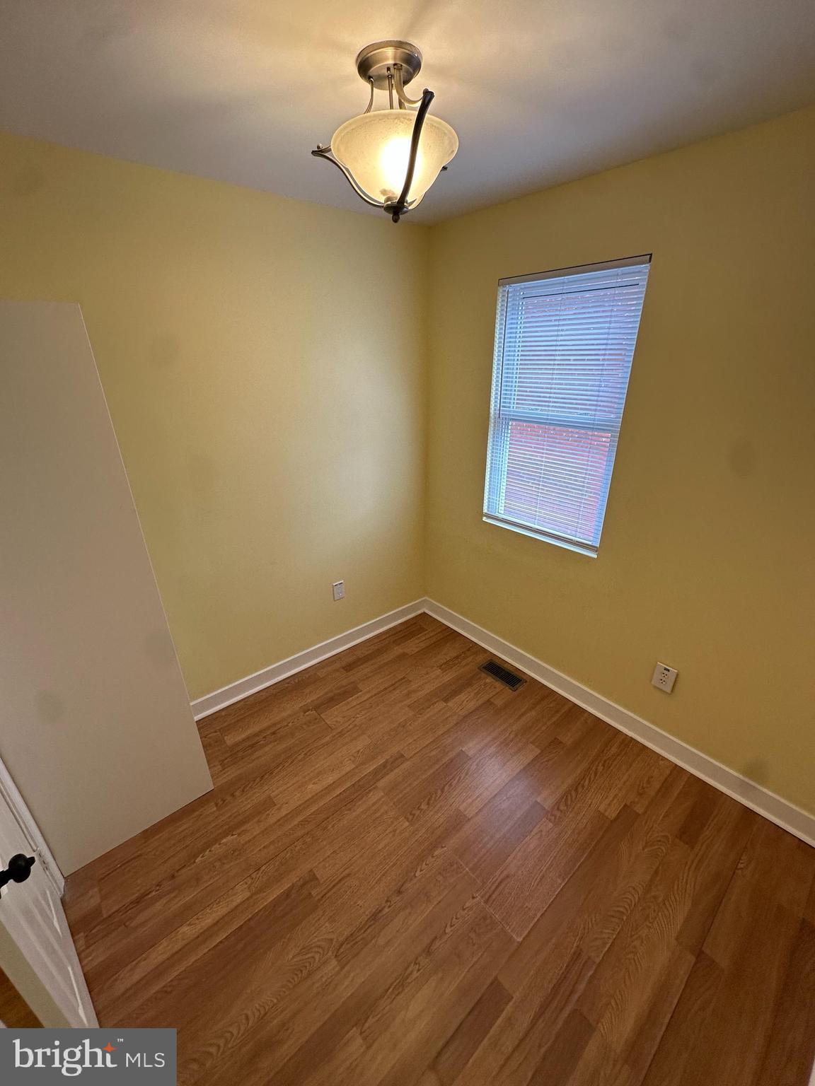 2712 Sherman Avenue Northwest Washington, DC 20001 - Photo 45 of 69 a view of empty room with wooden floor