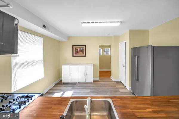 a living room with wooden floor and furniture