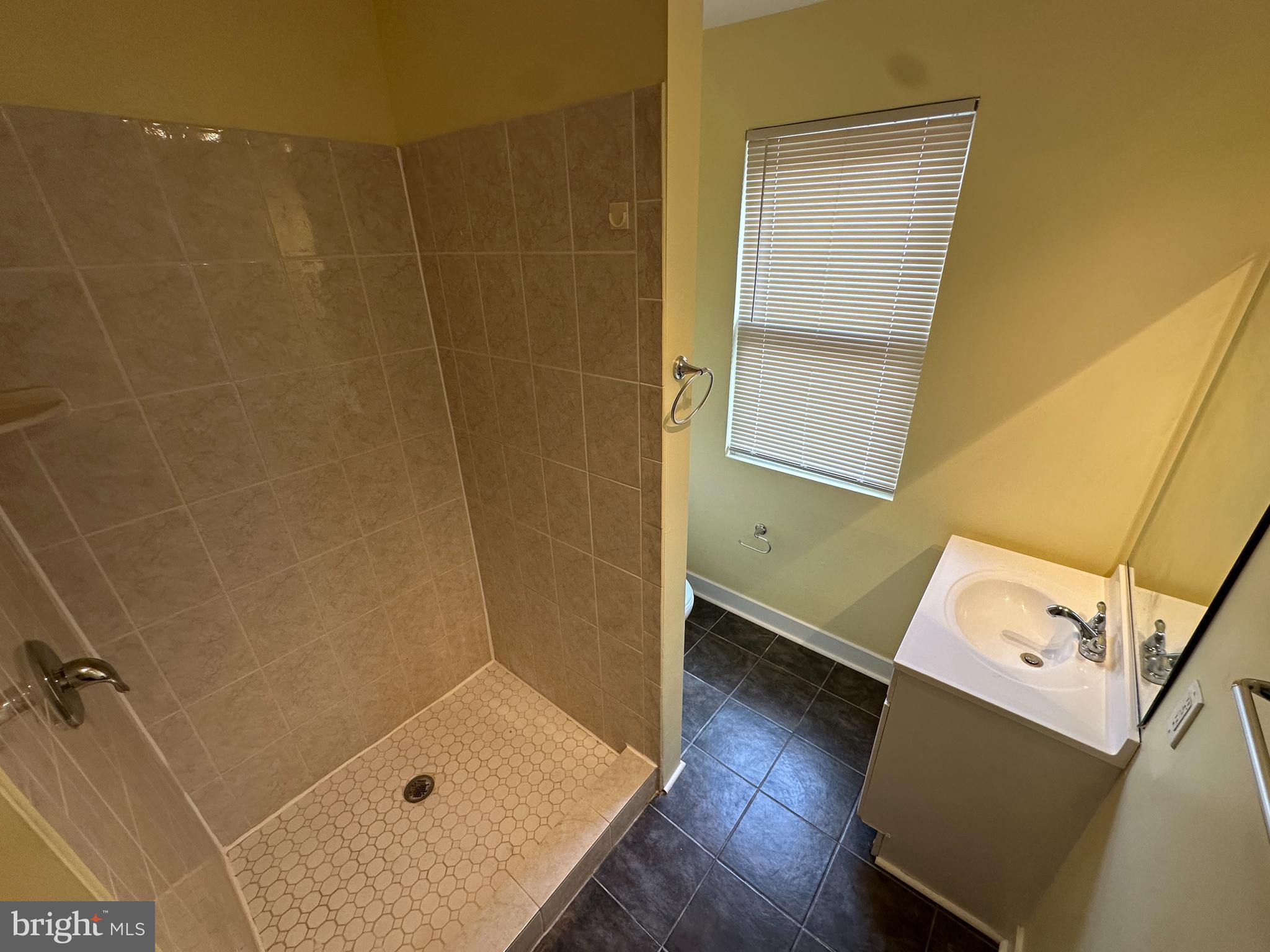 2712 Sherman Avenue Northwest Washington, DC 20001 - Photo 51 of 69 a bathroom with a tub and shower