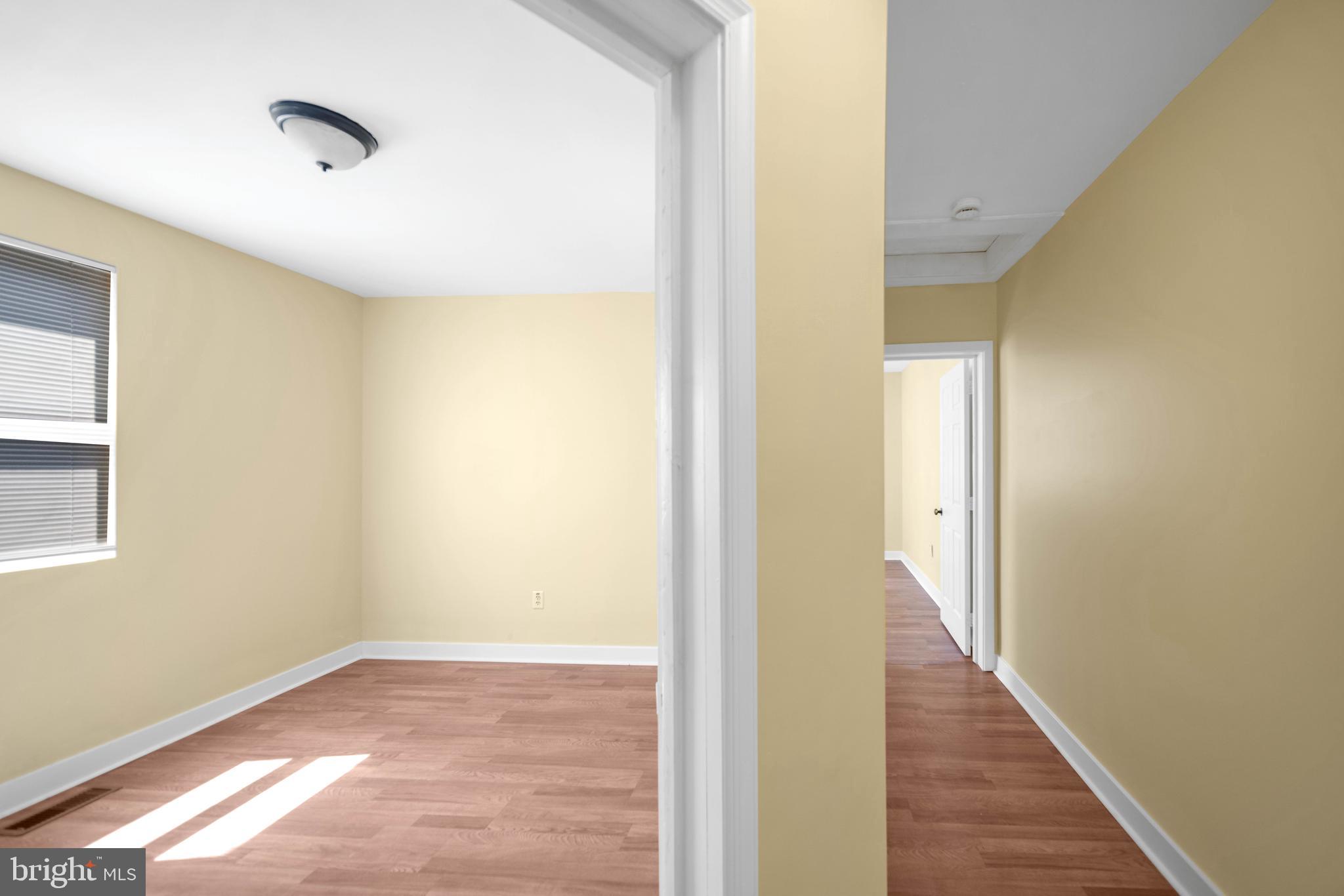 2712 Sherman Avenue Northwest Washington, DC 20001 - Photo 54 of 69 a view of a room with wooden floor and a bathroom