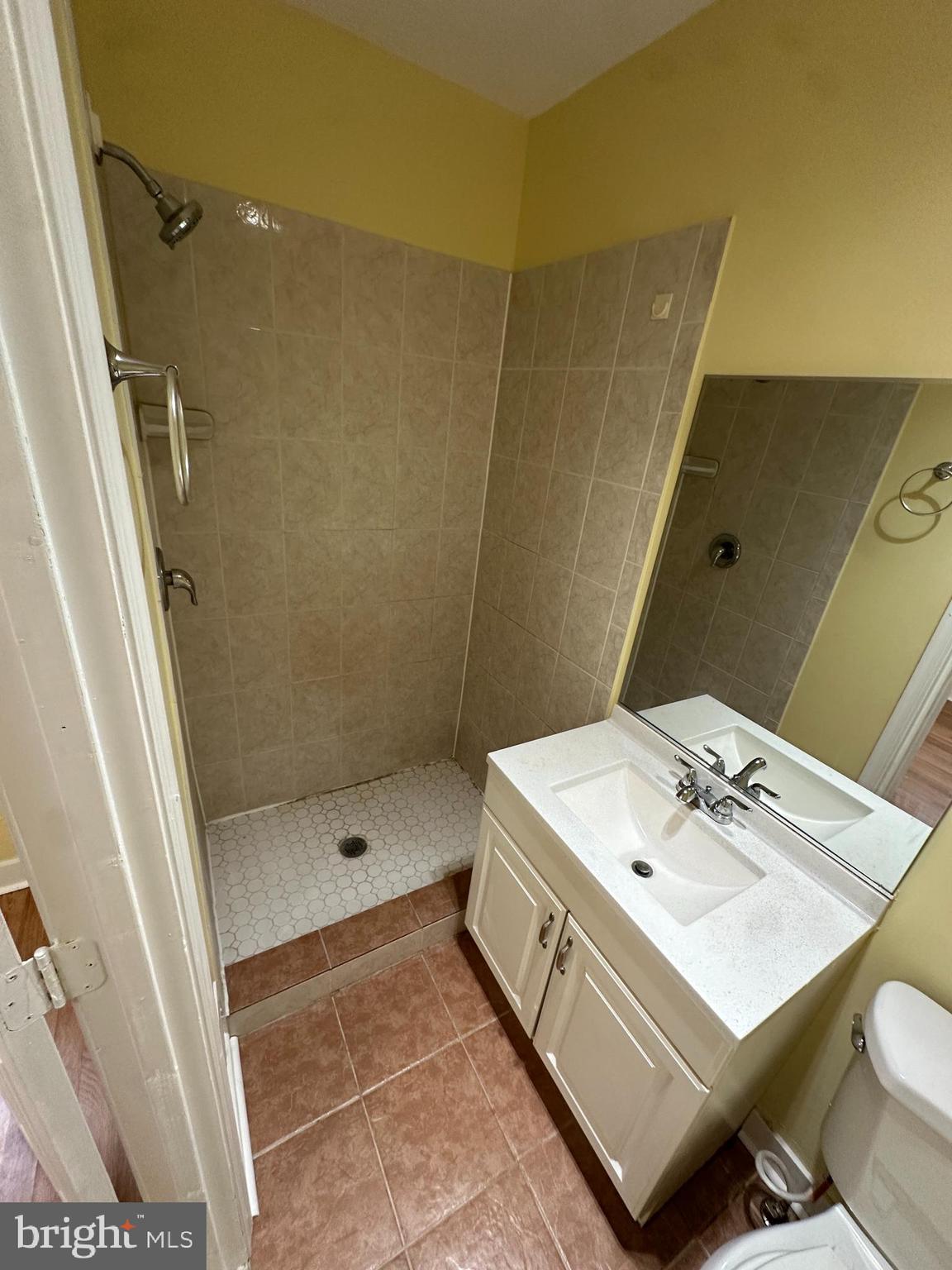 2712 Sherman Avenue Northwest Washington, DC 20001 - Photo 57 of 69 a bathroom with a sink toilet and shower