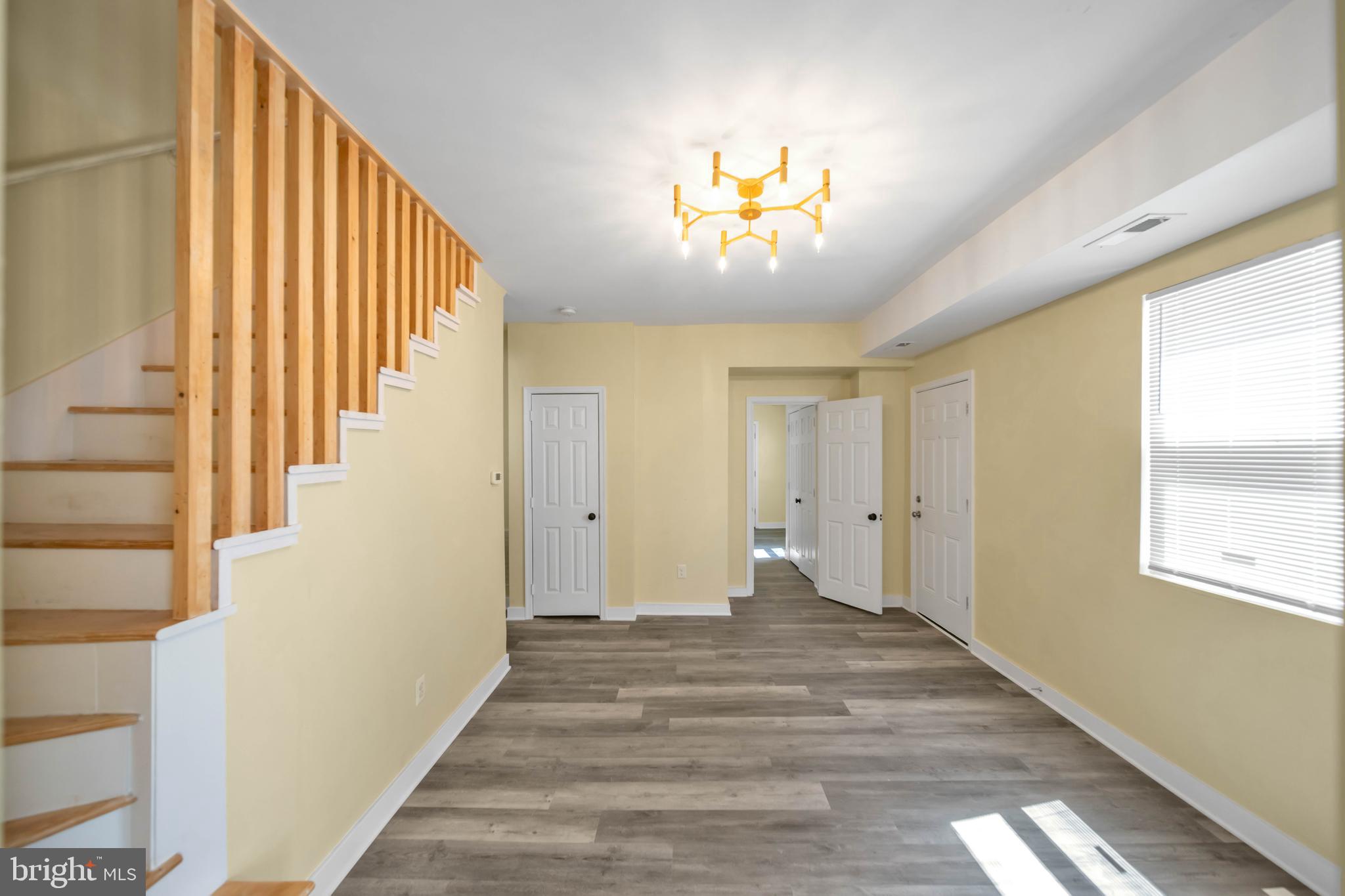 2712 Sherman Avenue Northwest Washington, DC 20001 - Photo 60 of 69 a view of a hallway to a bedroom with wooden floor and windows