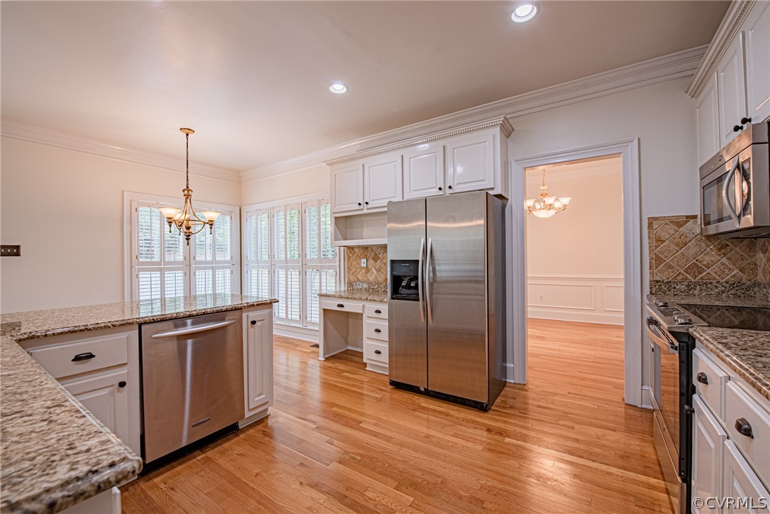 5314 Clipper Cove Road Midlothian, VA 23112 - Photo 15 of 47 a kitchen with stainless steel appliances granite countertop a refrigerator and a stove top oven