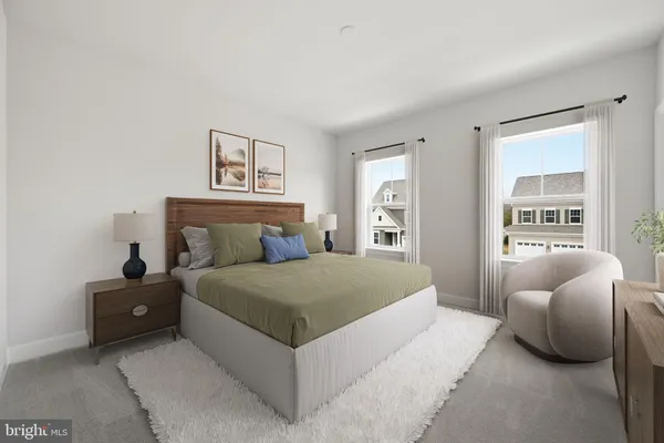 a bedroom with a bed and a couch