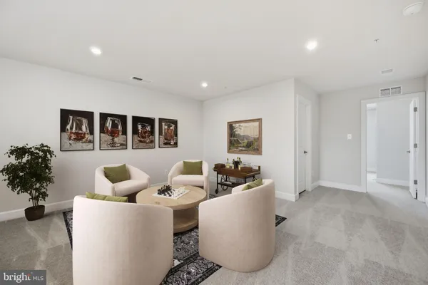 a living room with furniture and flowers