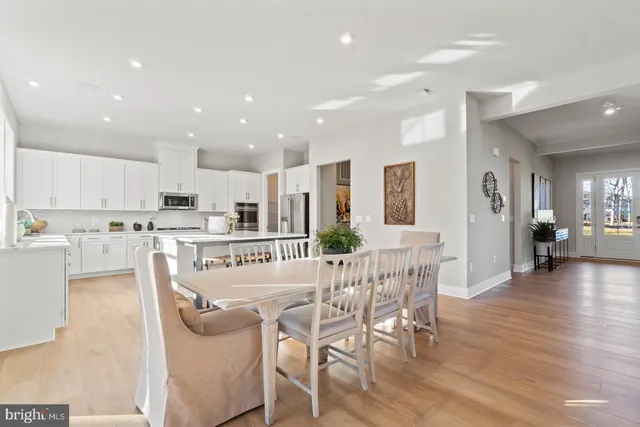 a view of a dining area with furniture and wooden floor