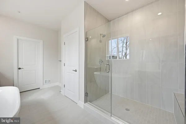a bathroom with a shower and a toilet