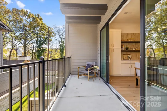 a view of balcony with furniture