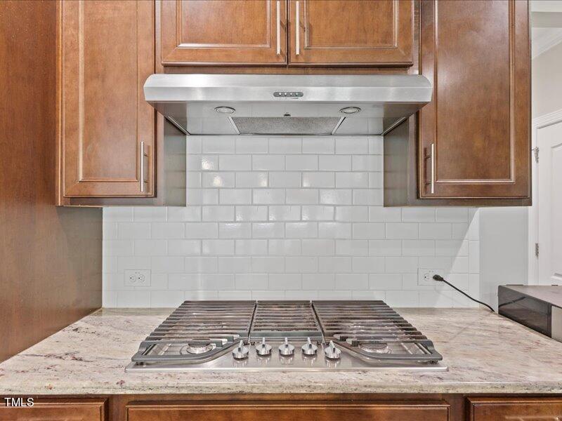1814 Capstone Drive Durham, NC 27713 - Photo 14 of 32 a stove top oven sitting inside of a kitchen