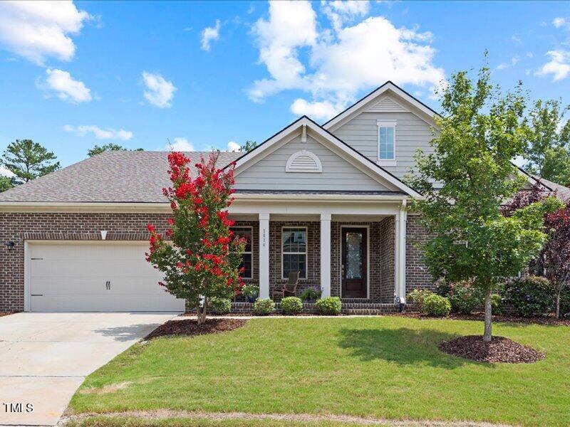 1814 Capstone Drive Durham, NC 27713 - Photo 2 of 32 a front view of a house with a yard