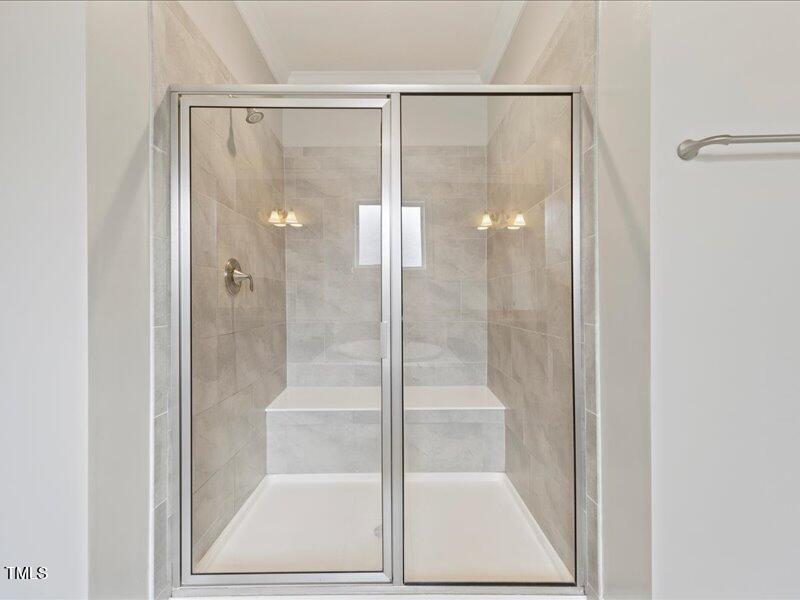1814 Capstone Drive Durham, NC 27713 - Photo 27 of 32 a bathroom with a glass shower door