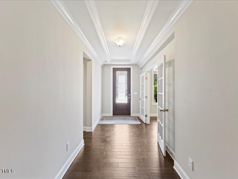 1814 Capstone Drive Durham, NC 27713 - Photo 4 of 32 a view of a hallway with wooden floor and a window