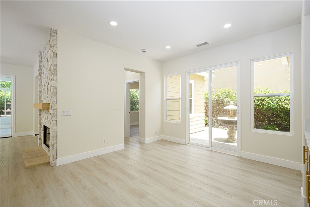 15 Plum Street Ladera Ranch, CA 92694 - Photo 34 of 113 a view of an empty room with wooden floor and a window