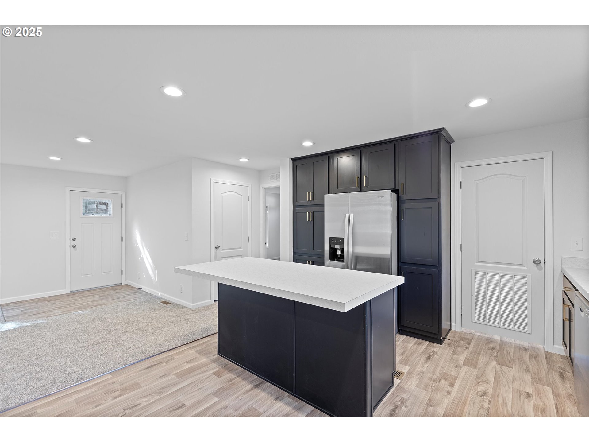 450 Southwest Juniper Road Estacada, OR 97023 - Photo 11 of 36 a room with a table chairs and refrigerator