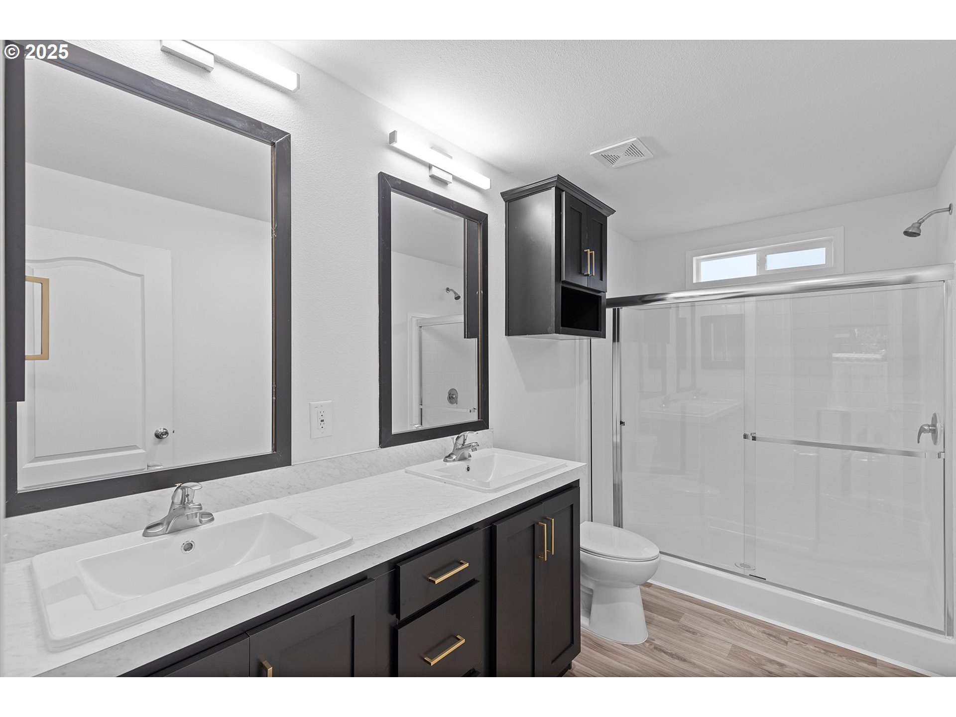 450 Southwest Juniper Road Estacada, OR 97023 - Photo 15 of 36 a bathroom with a double vanity sink mirror and shower