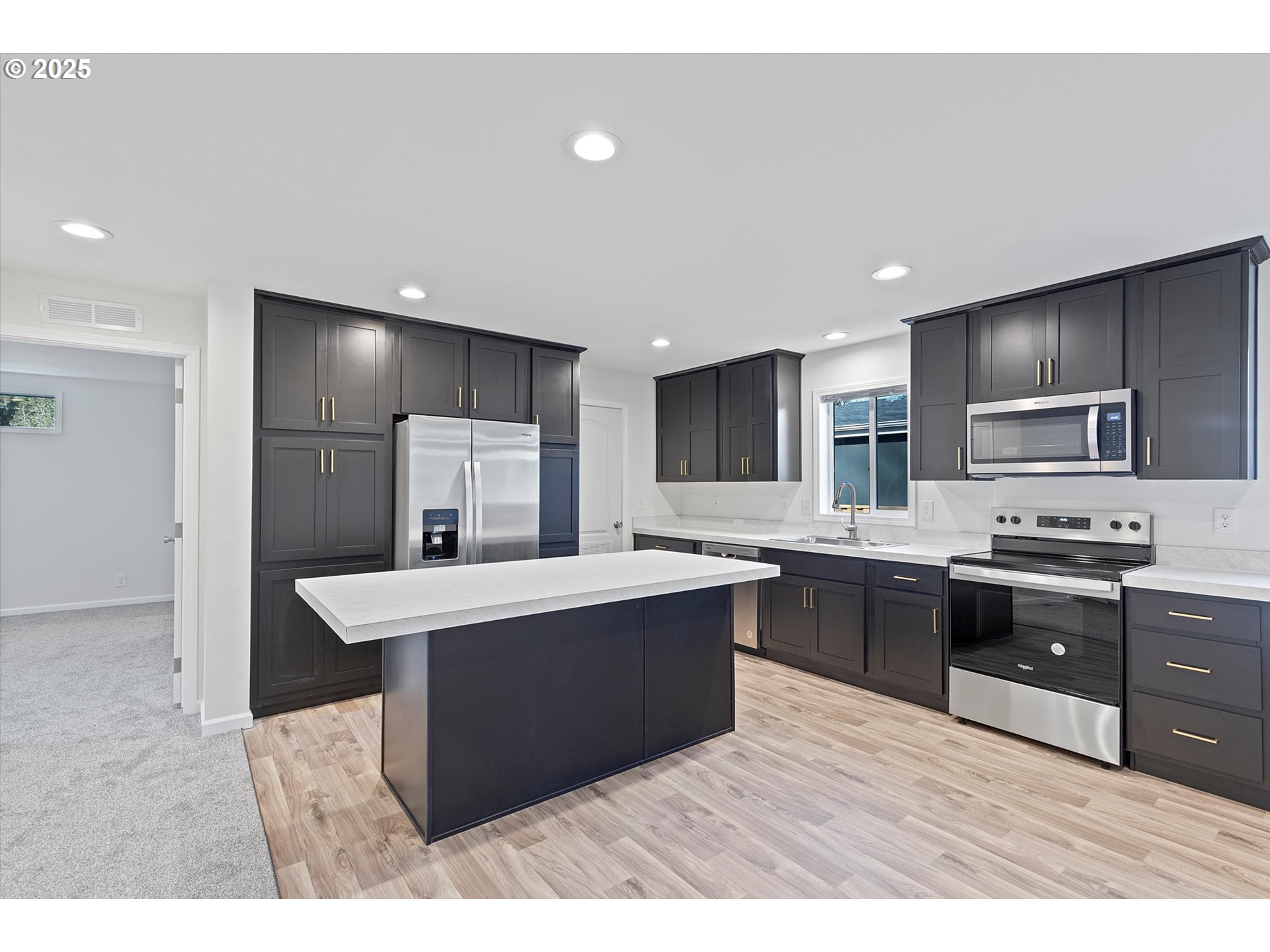 450 Southwest Juniper Road Estacada, OR 97023 - Photo 7 of 36 a kitchen with stainless steel appliances a sink stove and refrigerator