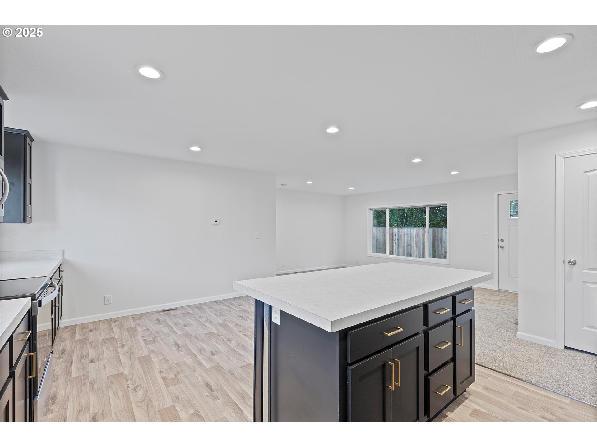 450 Southwest Juniper Road Estacada, OR 97023 - Photo 8 of 36 a kitchen that has a sink cabinets and wooden floor