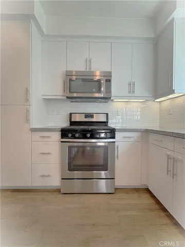 a bathroom with a shower and a vanity