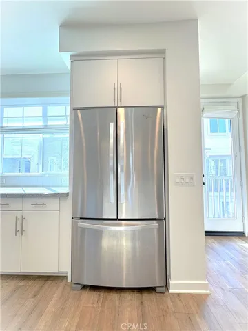 a view of an empty room with windows