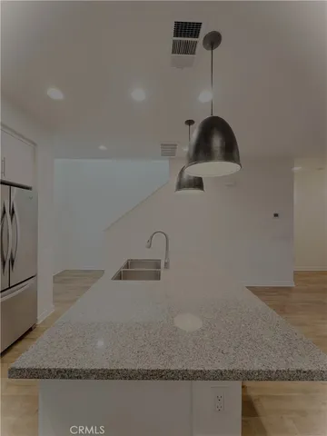 a view of a house with potted plants