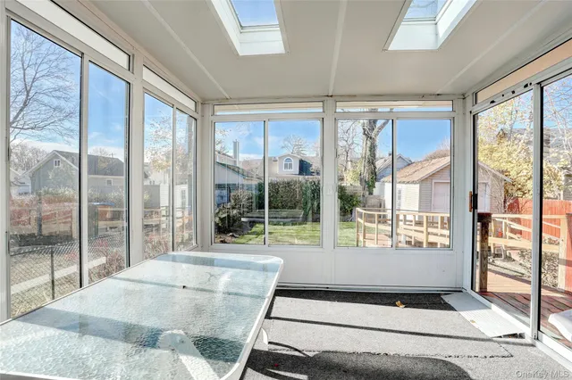 a living room with a large window and a couch
