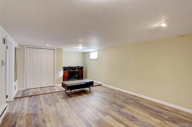 a room with wooden floor and couch