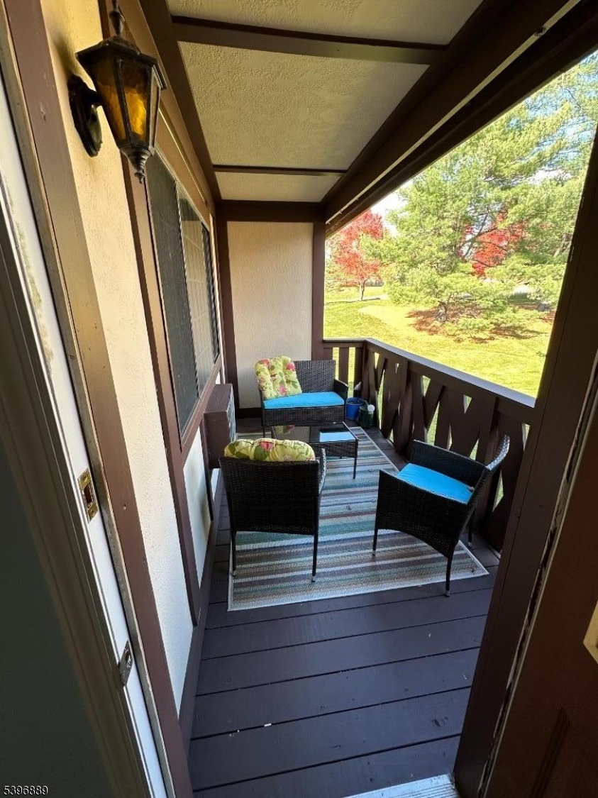 4D Avon Court Chatham, NJ 07928 - Photo 11 of 11 a view of deck with couch and wooden floor