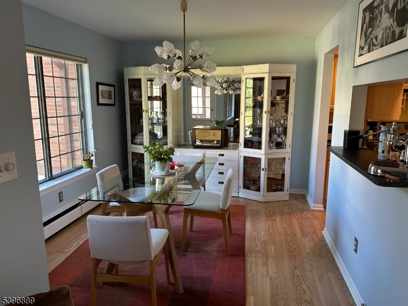 4D Avon Court Chatham, NJ 07928 - Photo 5 of 11 a view of a dining room with furniture window and wooden floor