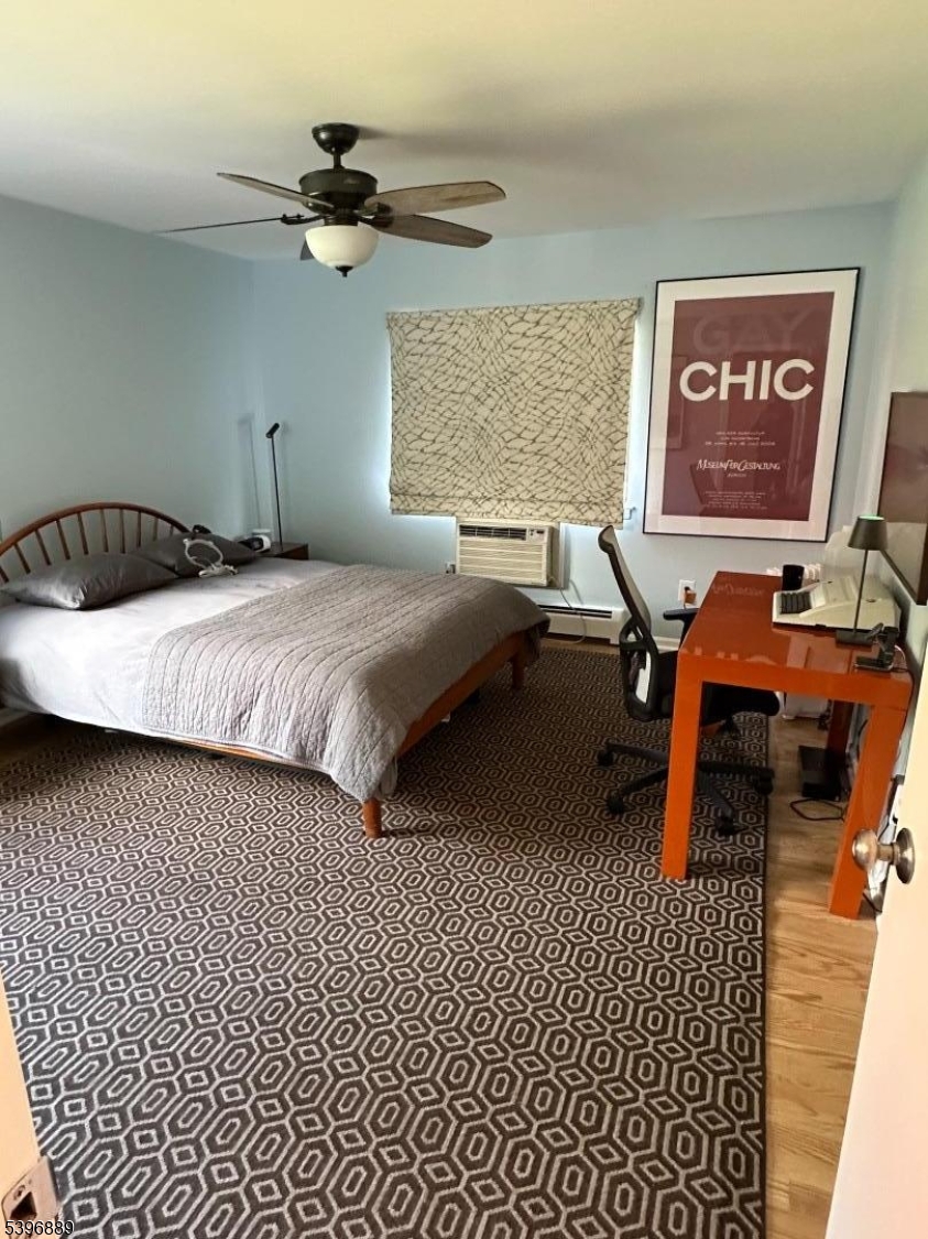 4D Avon Court Chatham, NJ 07928 - Photo 9 of 11 a bedroom with a bed and a table