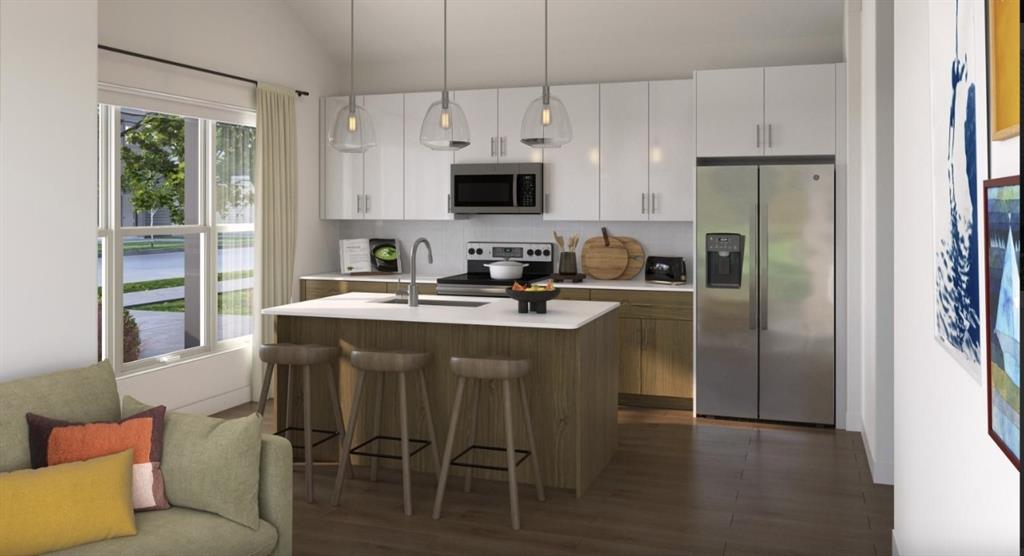 9032 Prairie Path, Unit 8929 Rowlett, TX 75089 - Photo 26 of 28 a kitchen with stainless steel appliances granite countertop a dining table chairs refrigerator and microwave