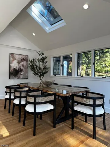 a view of a livingroom with furniture window and wooden floor
