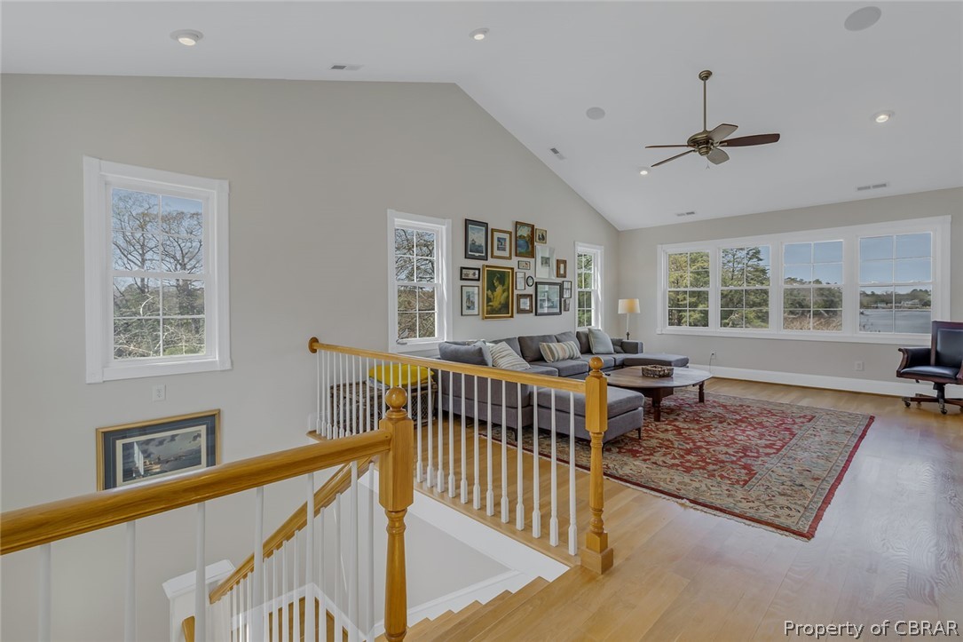 507 Sunnybank Road Reedville, VA 22539 - Photo 35 of 48 vaulted ceiling, ceiling fan, light wood-type flooring, and a wealth of natural light