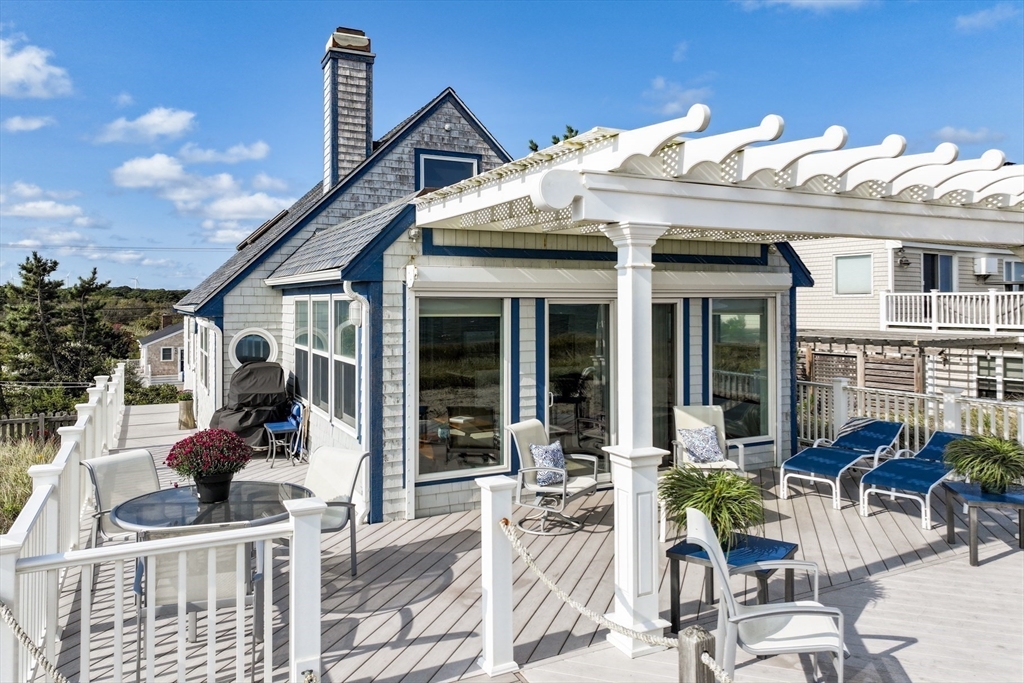 275 Phillips Road Sandwich, MA 02563 - Photo 1 of 40 a view of a house with patio outdoor seating