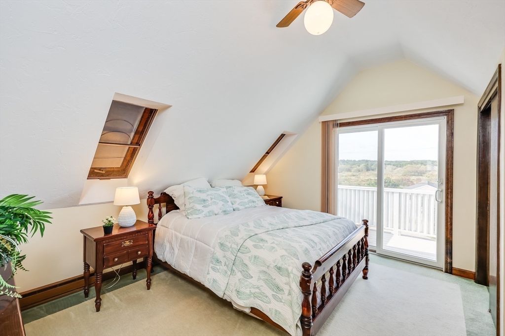 275 Phillips Road Sandwich, MA 02563 - Photo 21 of 40 a bedroom with a bed and a window
