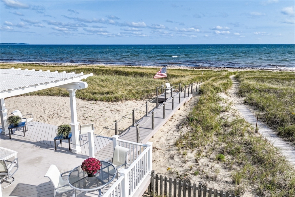 275 Phillips Road Sandwich, MA 02563 - Photo 4 of 40 a view of an ocean and a beach
