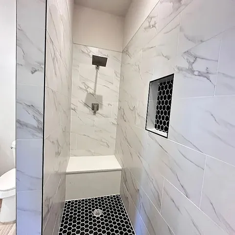 a view of a backyard with wooden fence