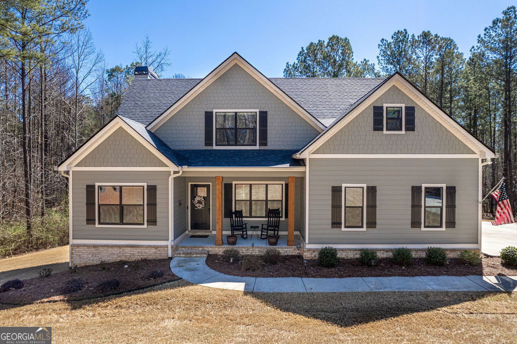 a front view of a house with yard