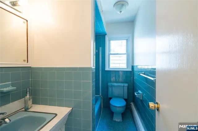 a bathroom with a toilet and a sink