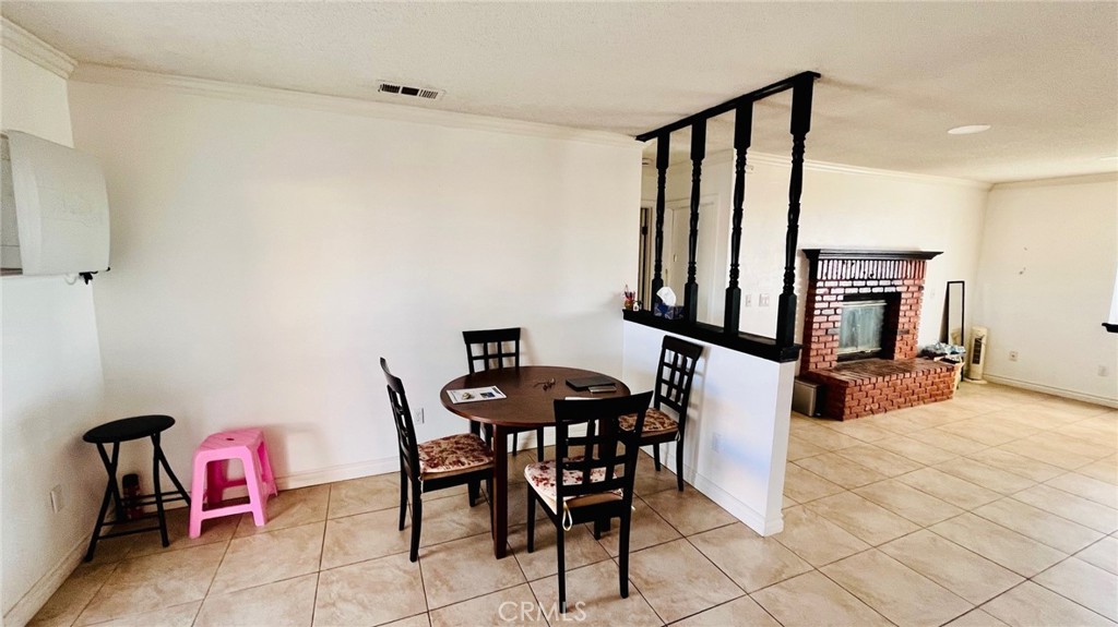 11911 Kiowa Road Apple Valley, CA 92308 - Photo 19 of 40 a view of a dining room with furniture