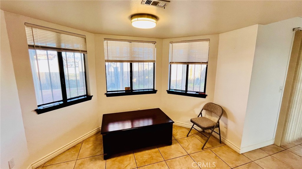 11911 Kiowa Road Apple Valley, CA 92308 - Photo 21 of 40 a room with furniture and windows