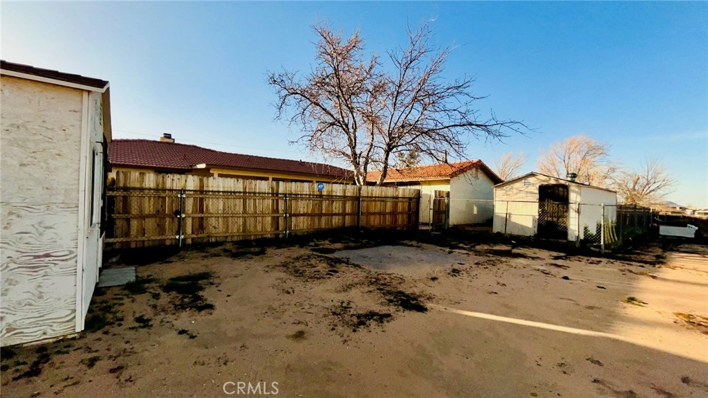 11911 Kiowa Road Apple Valley, CA 92308 - Photo 36 of 40 a front view of a house with a yard