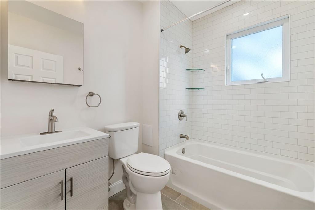 311 Elsdon Street Pittsburgh, PA 15214 - Photo 14 of 35 a bathroom with a sink toilet and shower