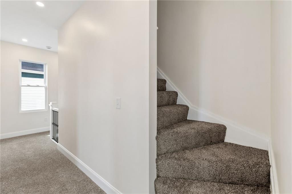 311 Elsdon Street Pittsburgh, PA 15214 - Photo 18 of 35 a living room with furniture and a hallway