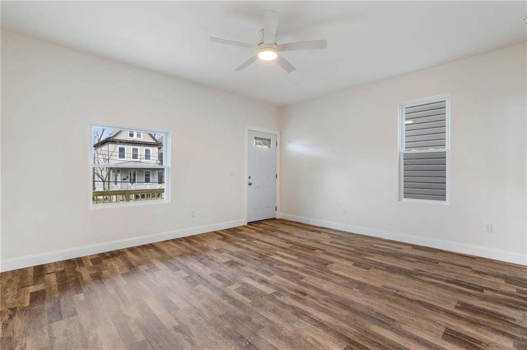 311 Elsdon Street Pittsburgh, PA 15214 - Photo 10 of 35 a view of an empty room with window and wooden floor