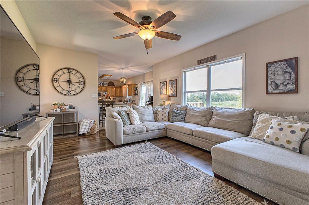 142 Lentz Road Latrobe, PA 15650 - Photo 12 of 32 a living room with furniture a chandelier fan and a large window