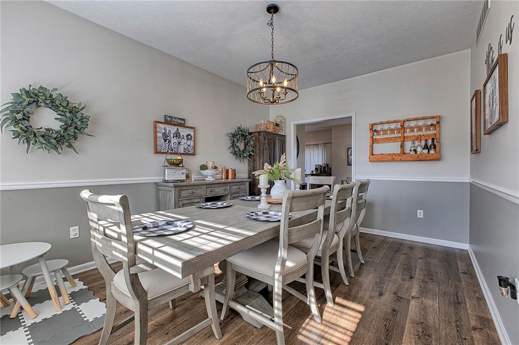 142 Lentz Road Latrobe, PA 15650 - Photo 13 of 32 a view of a dining room with furniture wooden floor and chandelier
