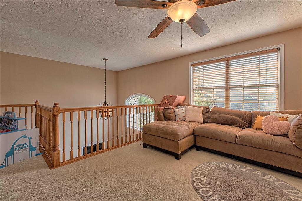 142 Lentz Road Latrobe, PA 15650 - Photo 16 of 32 a living room with furniture and a large window