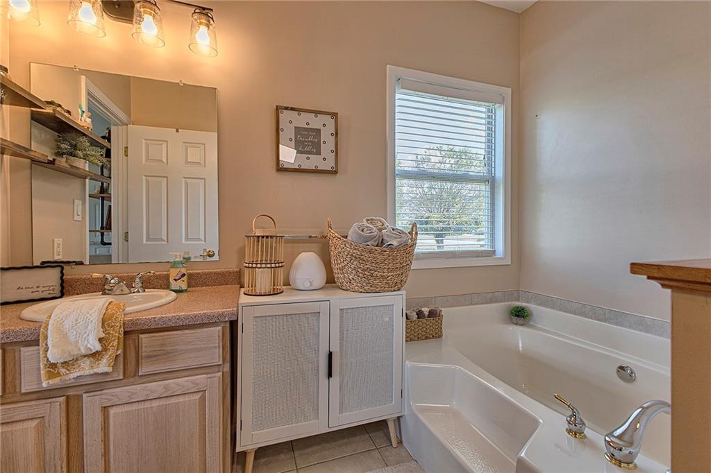 142 Lentz Road Latrobe, PA 15650 - Photo 20 of 32 a bathroom with a tub sink and mirror